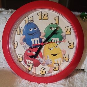 Vintage M&M clock, works on AA battery. Can hang on wall.
